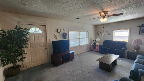 a view of hallway with wooden floor