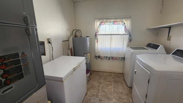 a backyard of a house with a yard and outdoor seating