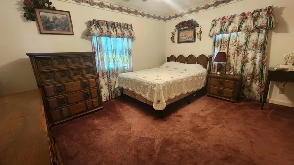 a bedroom with a bed and a cabinets