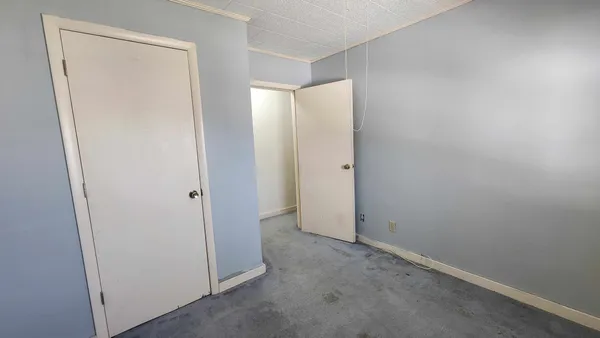 a view of a hallway and dining room