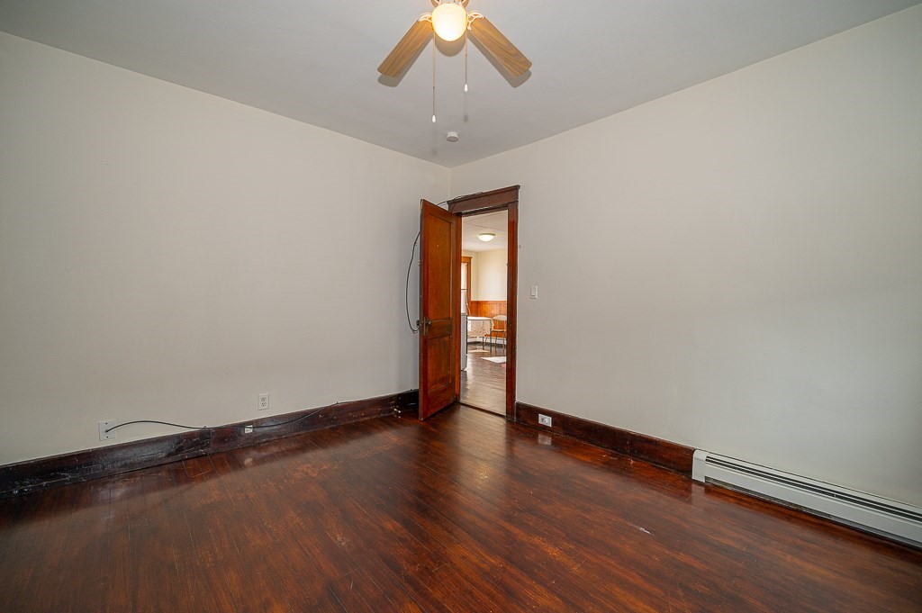 19 Fifth Avenue Worcester, MA 01607 - Photo 17 of 42 a view of an empty room with wooden floor and a window