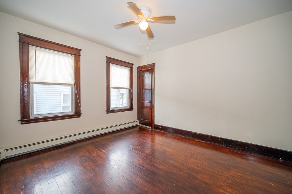 19 Fifth Avenue Worcester, MA 01607 - Photo 19 of 42 a view of an empty room with window and wooden floor