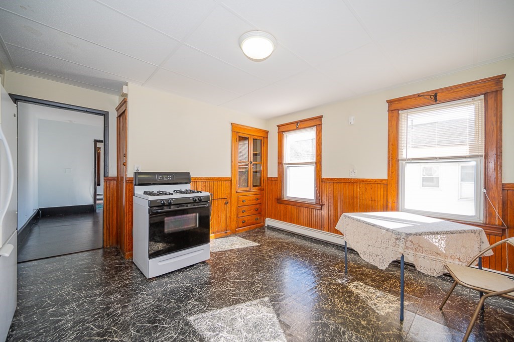 19 Fifth Avenue Worcester, MA 01607 - Photo 21 of 42 a kitchen with a stove a sink and a refrigerator
