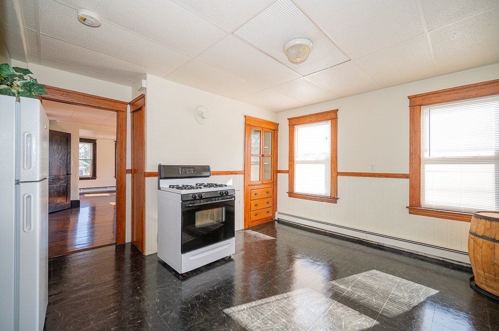 19 Fifth Avenue Worcester, MA 01607 - Photo 28 of 42 a kitchen with stainless steel appliances granite countertop a stove and a refrigerator