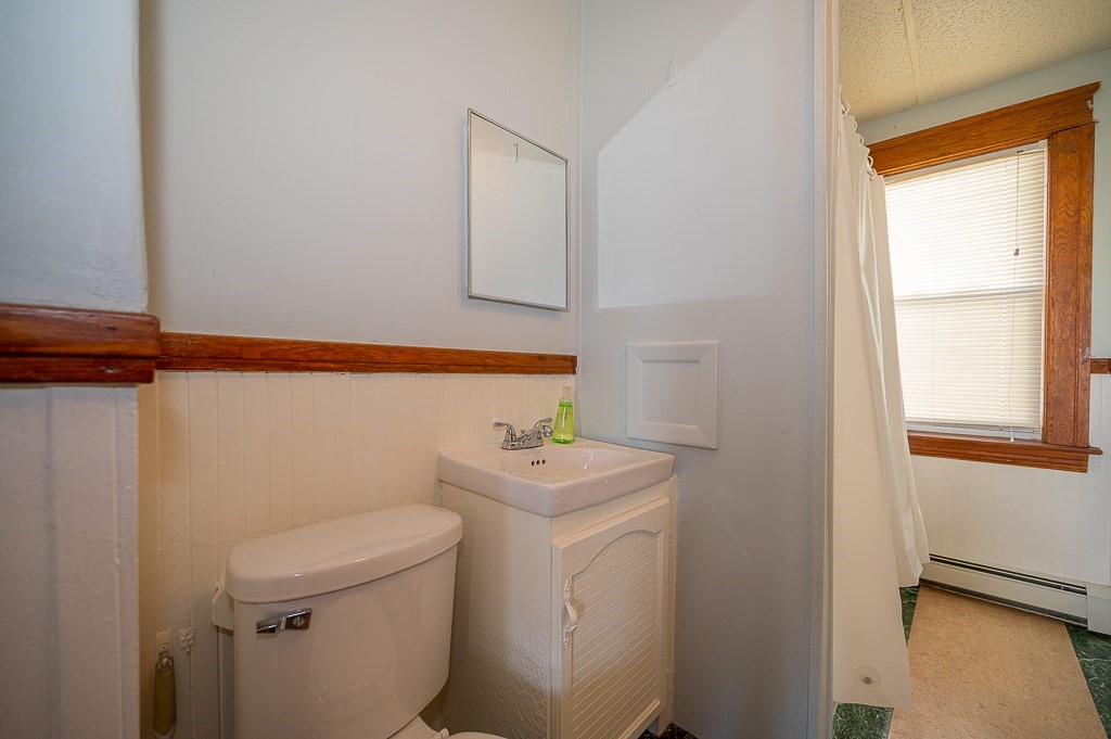 19 Fifth Avenue Worcester, MA 01607 - Photo 33 of 42 a bathroom with a sink a toilet and a window