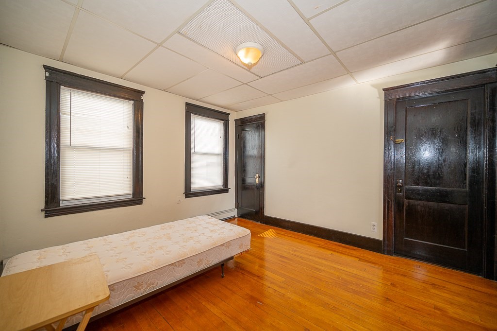 19 Fifth Avenue Worcester, MA 01607 - Photo 34 of 42 a spacious bedroom with a bed and a window