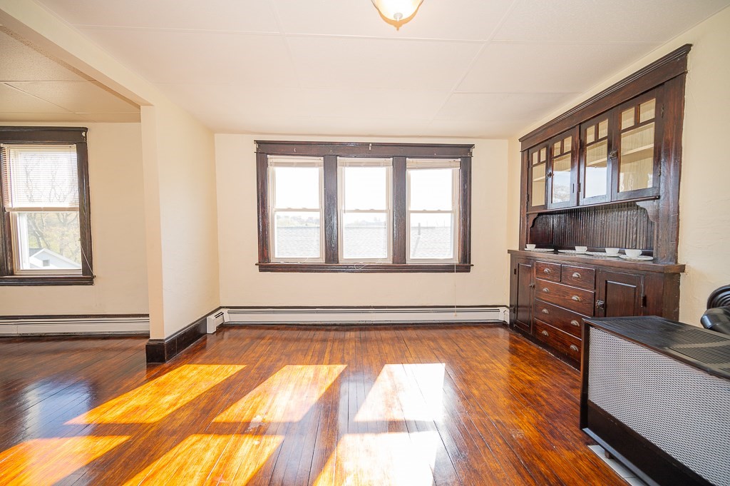 19 Fifth Avenue Worcester, MA 01607 - Photo 35 of 42 a living room with hardwood floor and a window