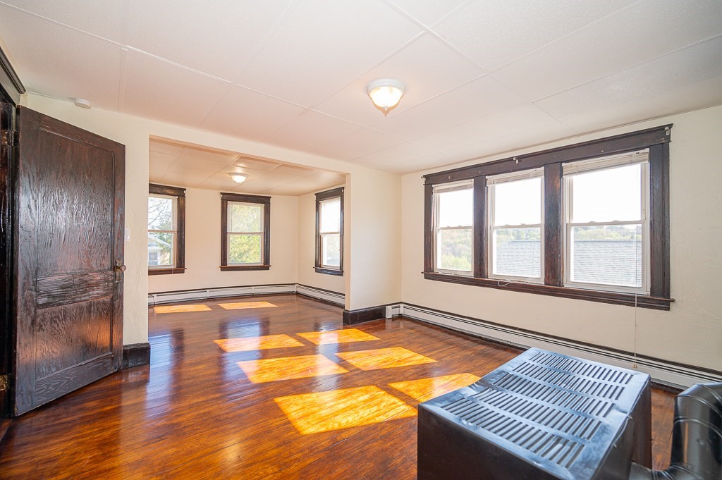 19 Fifth Avenue Worcester, MA 01607 - Photo 36 of 42 a view of an empty room with window and wooden floor