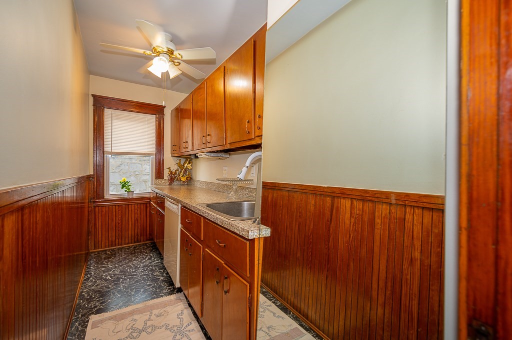 19 Fifth Avenue Worcester, MA 01607 - Photo 4 of 42 a kitchen with stainless steel appliances granite countertop a sink and cabinets