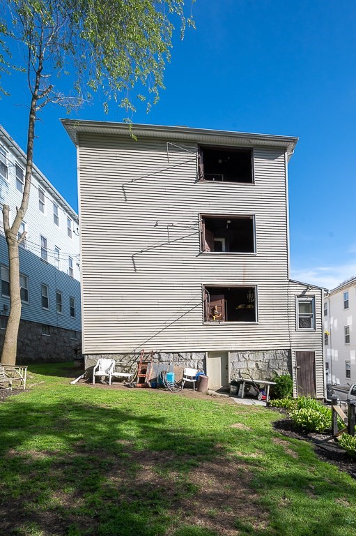 19 Fifth Avenue Worcester, MA 01607 - Photo 41 of 42 a backyard of a house with lots of green space