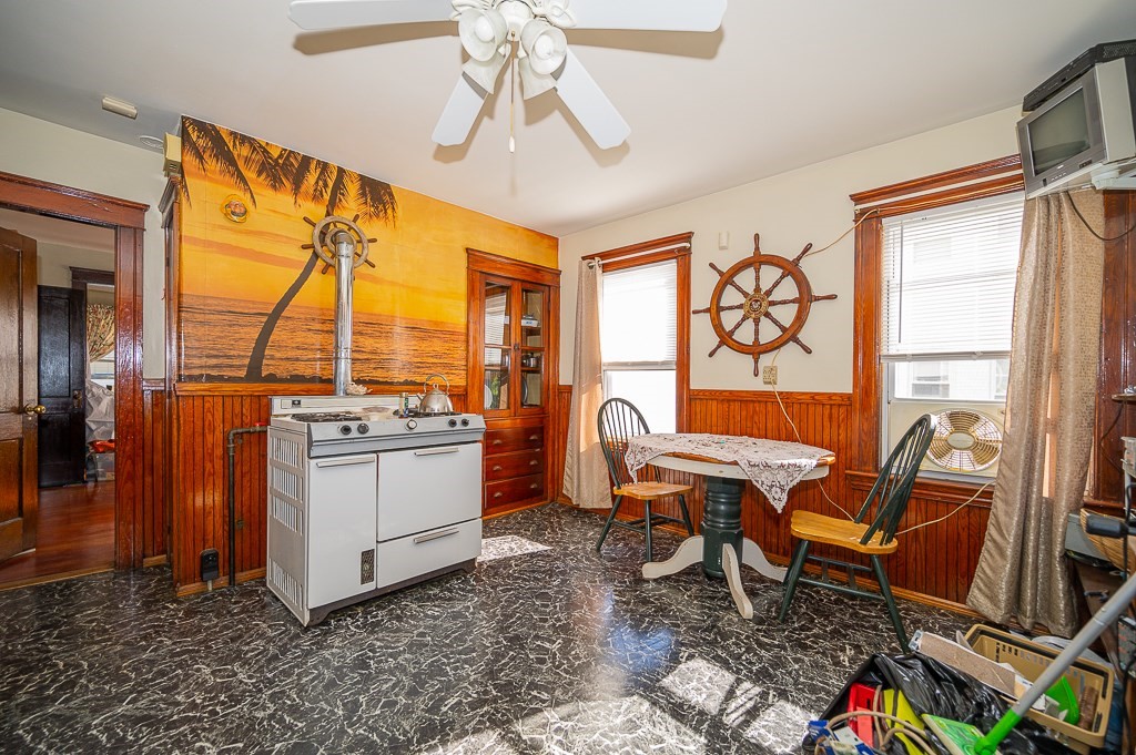 19 Fifth Avenue Worcester, MA 01607 - Photo 5 of 42 a living room with furniture a flat screen tv and a floor to ceiling window