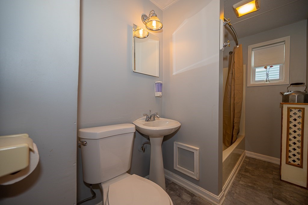 19 Fifth Avenue Worcester, MA 01607 - Photo 6 of 42 a bathroom with a toilet a sink and a mirror