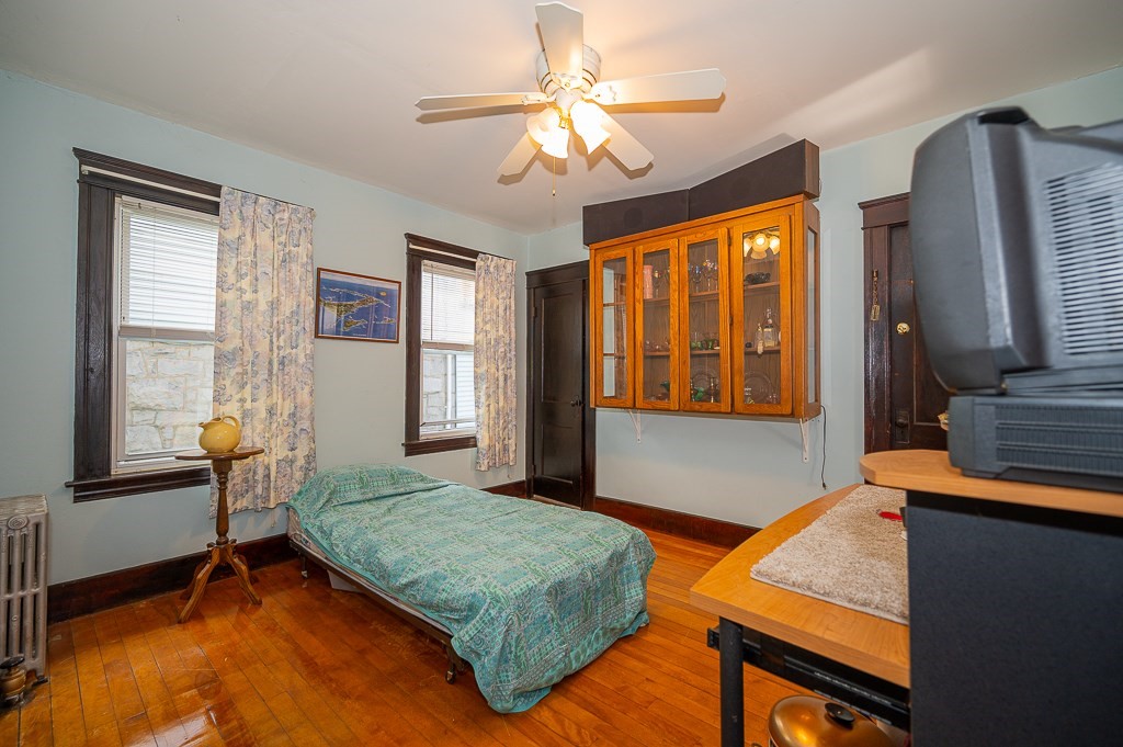 19 Fifth Avenue Worcester, MA 01607 - Photo 7 of 42 a bedroom with a bed and a window with balcony view