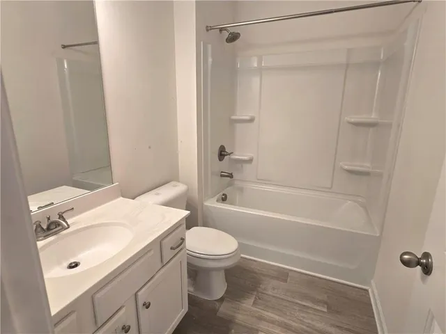 a bathroom with a sink a toilet and a bathtub