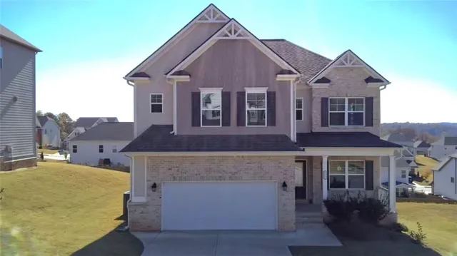 a front view of a house with a yard