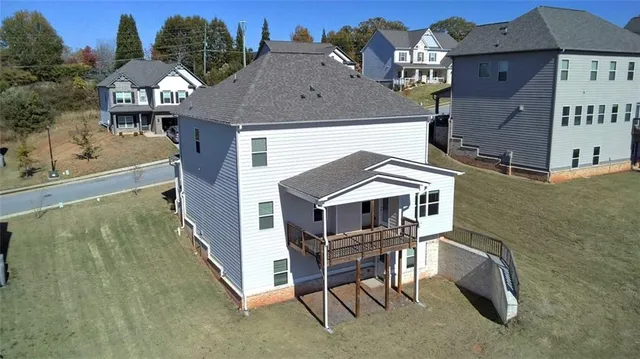 a aerial view of a house with table and chairs