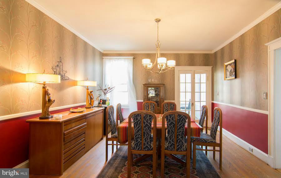 3933 Keswick Road Baltimore, MD 21211 - Photo 7 of 21 a view of a dining room with furniture window and wooden floor