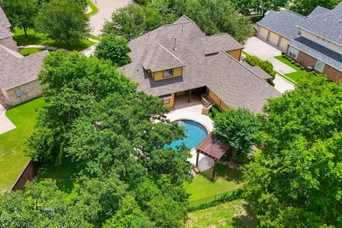 an aerial view of house with yard