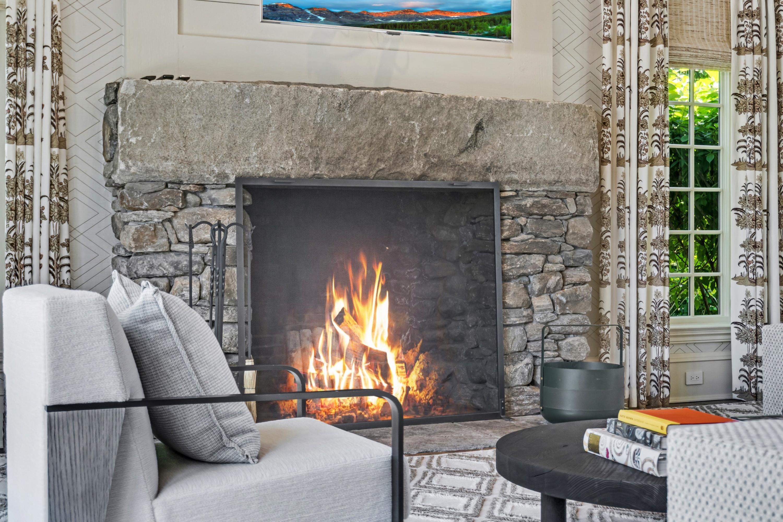 90 Long Neck Point Road Darien, CT 06820 - Photo 13 of 37 a living room with furniture and a fireplace