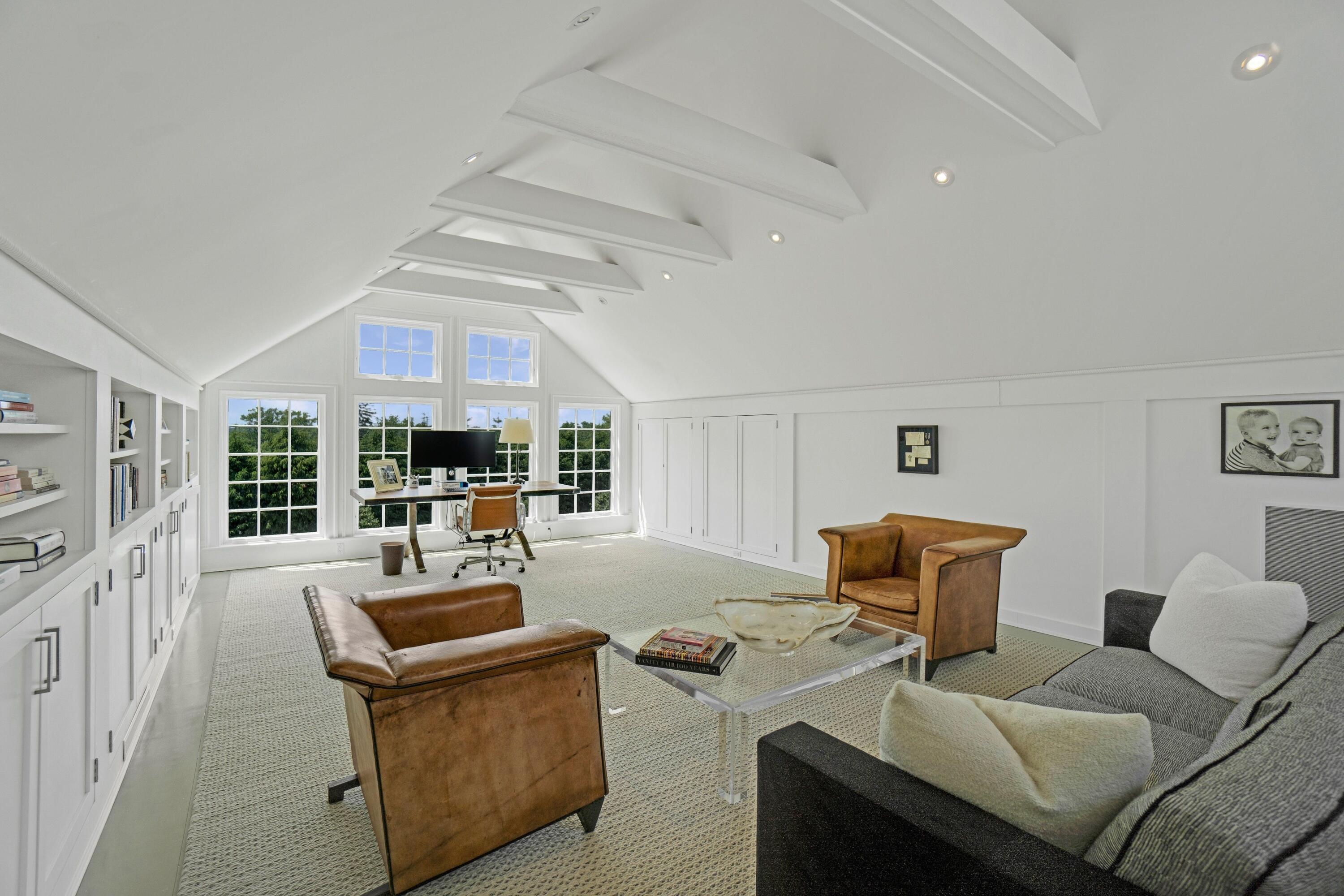 90 Long Neck Point Road Darien, CT 06820 - Photo 14 of 37 a living room with furniture and a large window