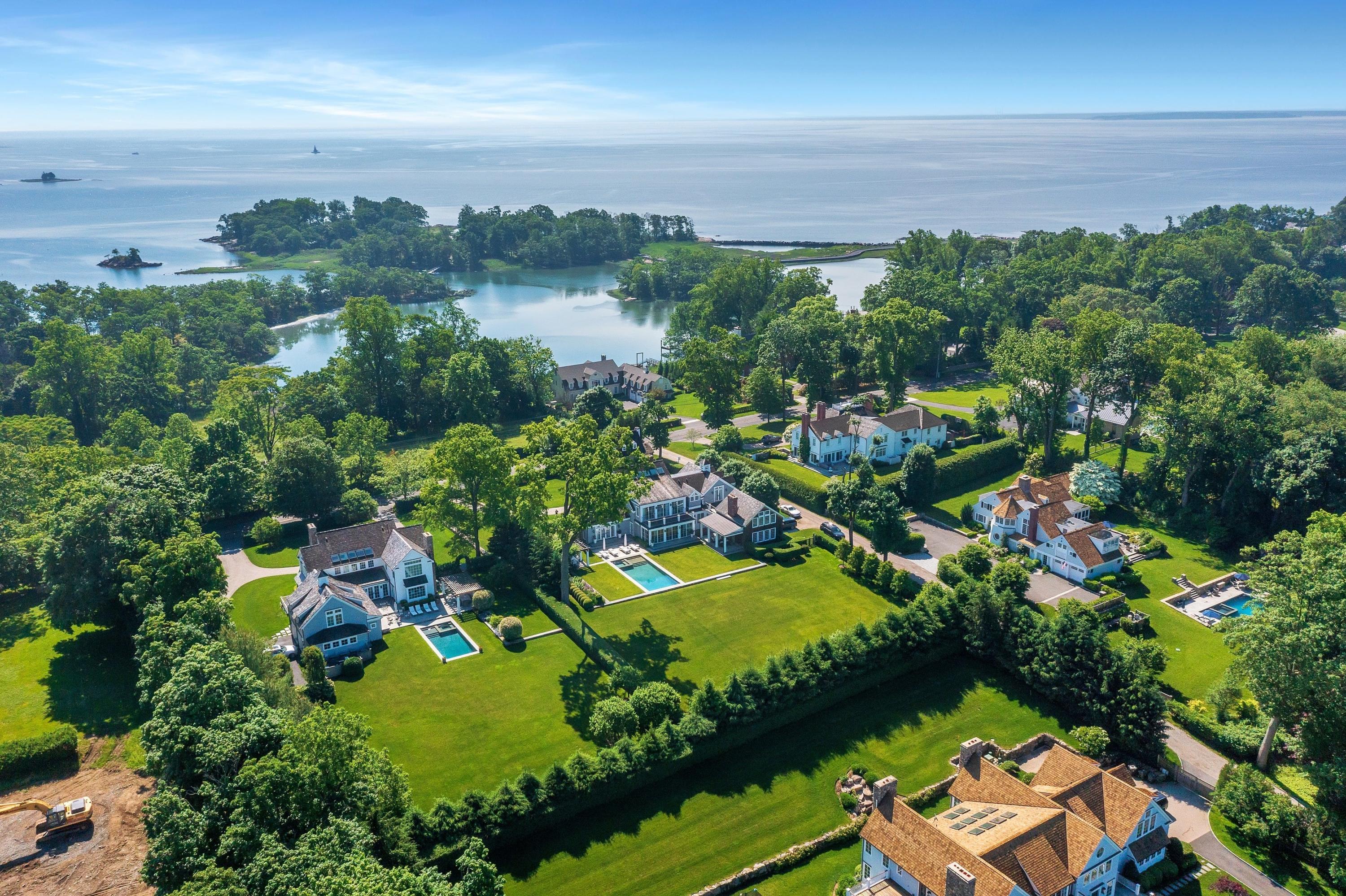 90 Long Neck Point Road Darien, CT 06820 - Photo 3 of 37 an aerial view of residential houses with outdoor space and trees