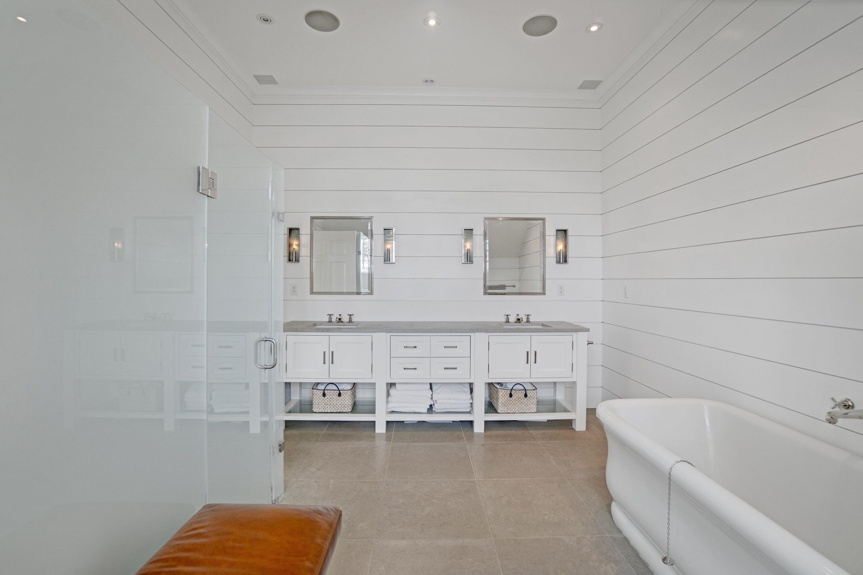 90 Long Neck Point Road Darien, CT 06820 - Photo 23 of 37 a bathroom with a bathtub and a sink