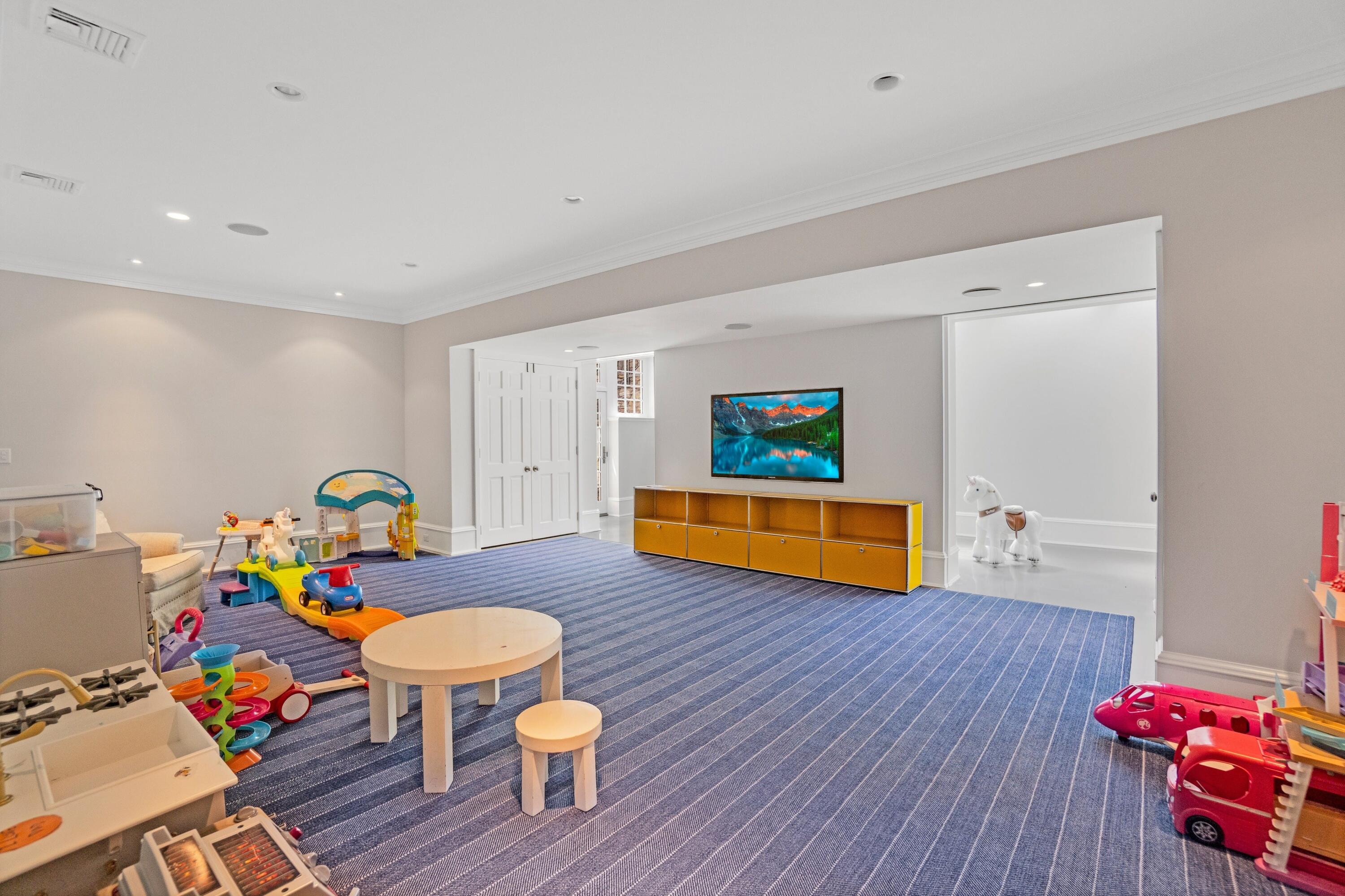 90 Long Neck Point Road Darien, CT 06820 - Photo 29 of 37 a living room with furniture and wooden floor