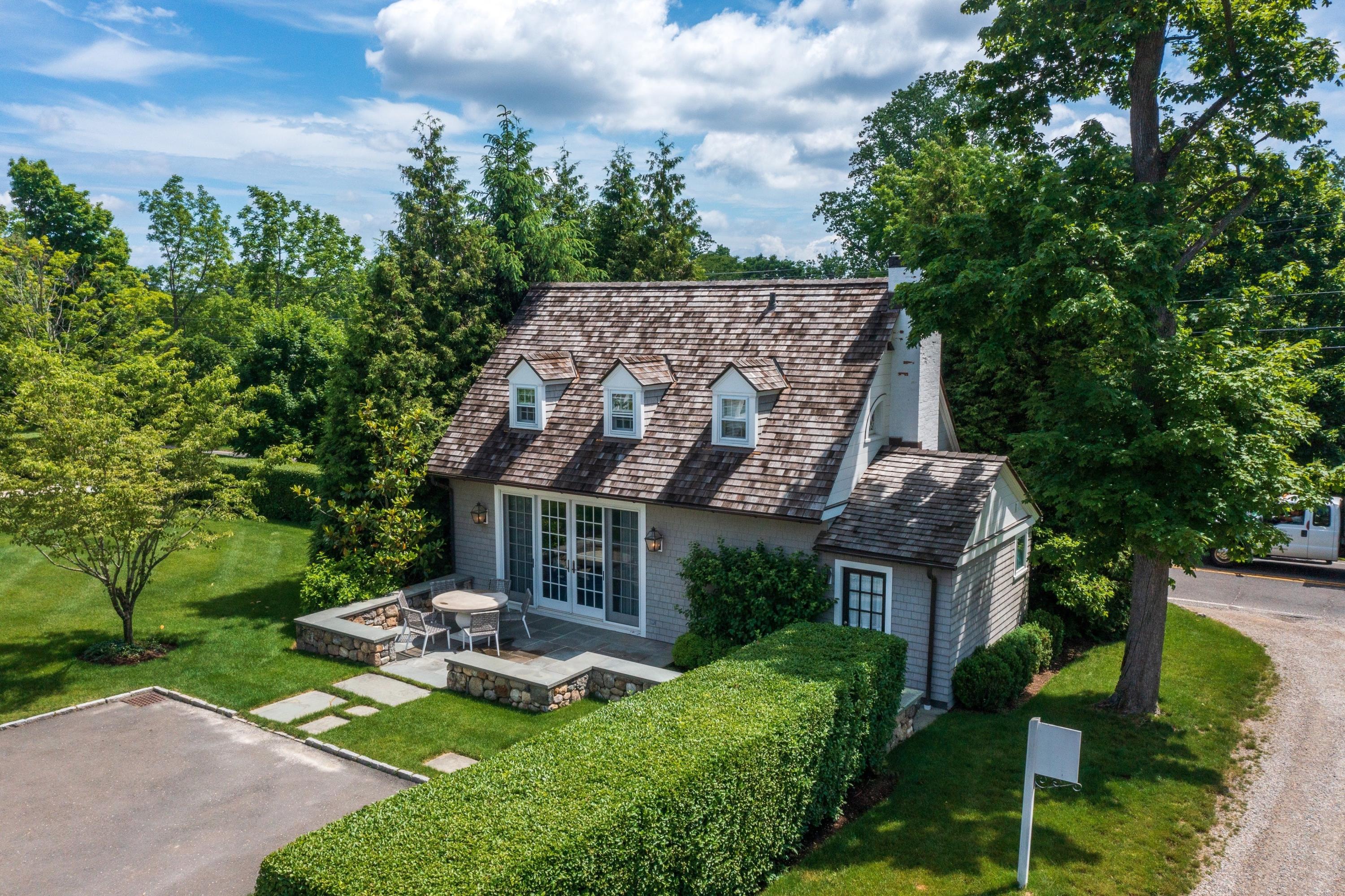 90 Long Neck Point Road Darien, CT 06820 - Photo 30 of 37 an aerial view of a house with garden space and street view