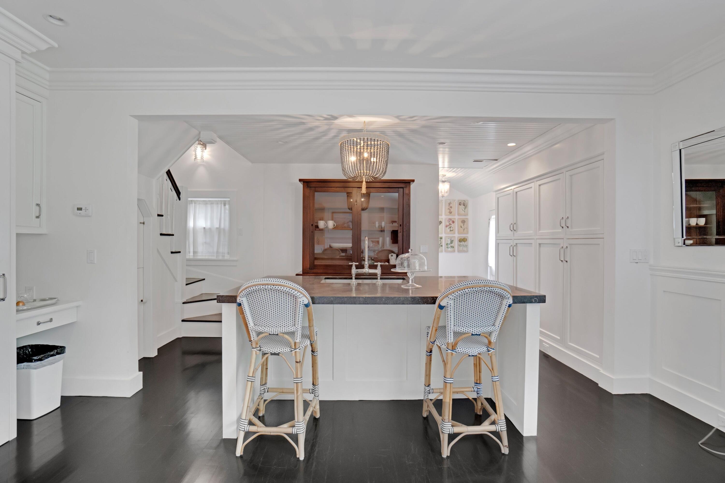 90 Long Neck Point Road Darien, CT 06820 - Photo 32 of 37 a view of a dining room with furniture and wooden floor