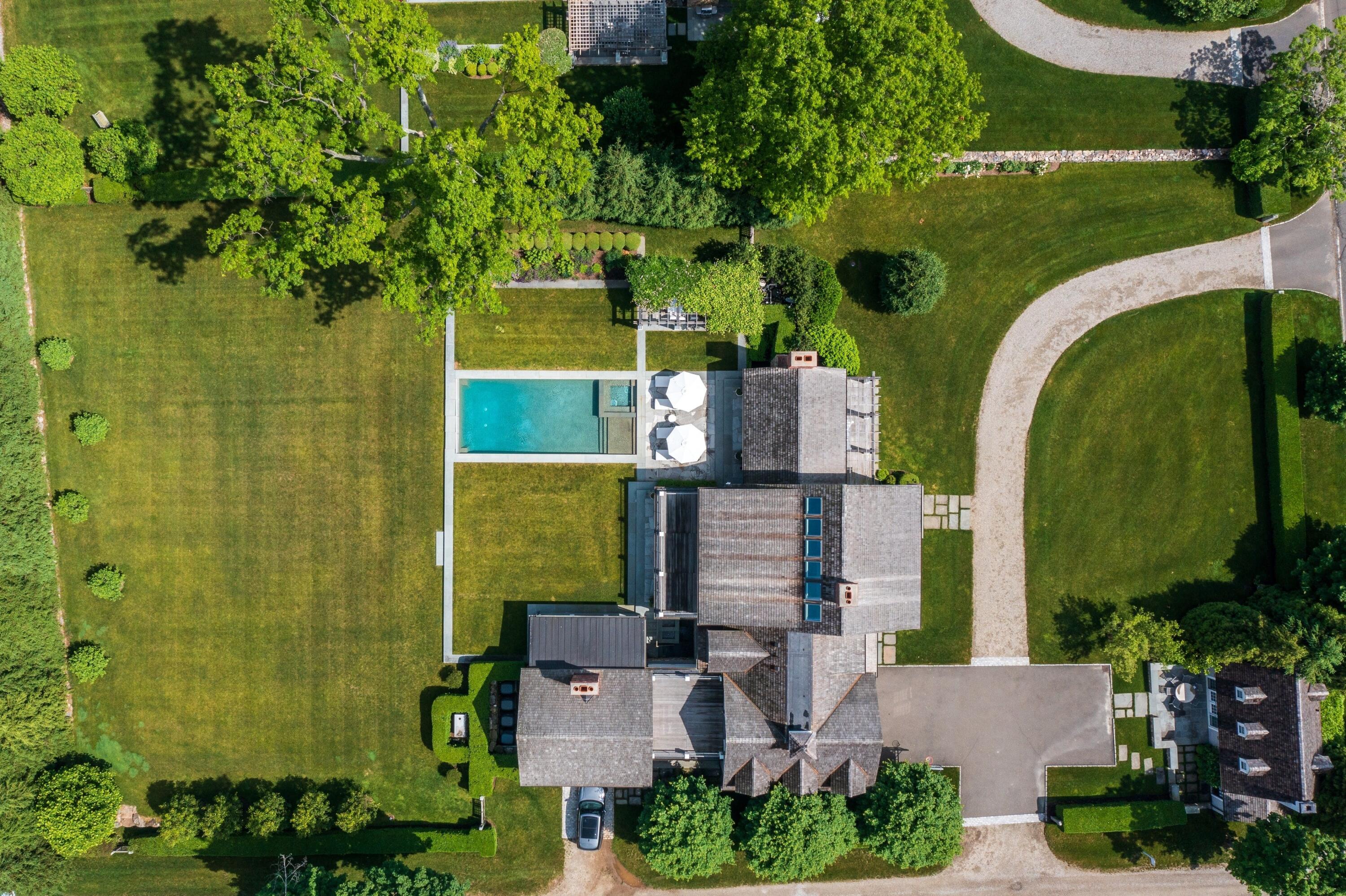 90 Long Neck Point Road Darien, CT 06820 - Photo 33 of 37 an aerial view of a house with a garden