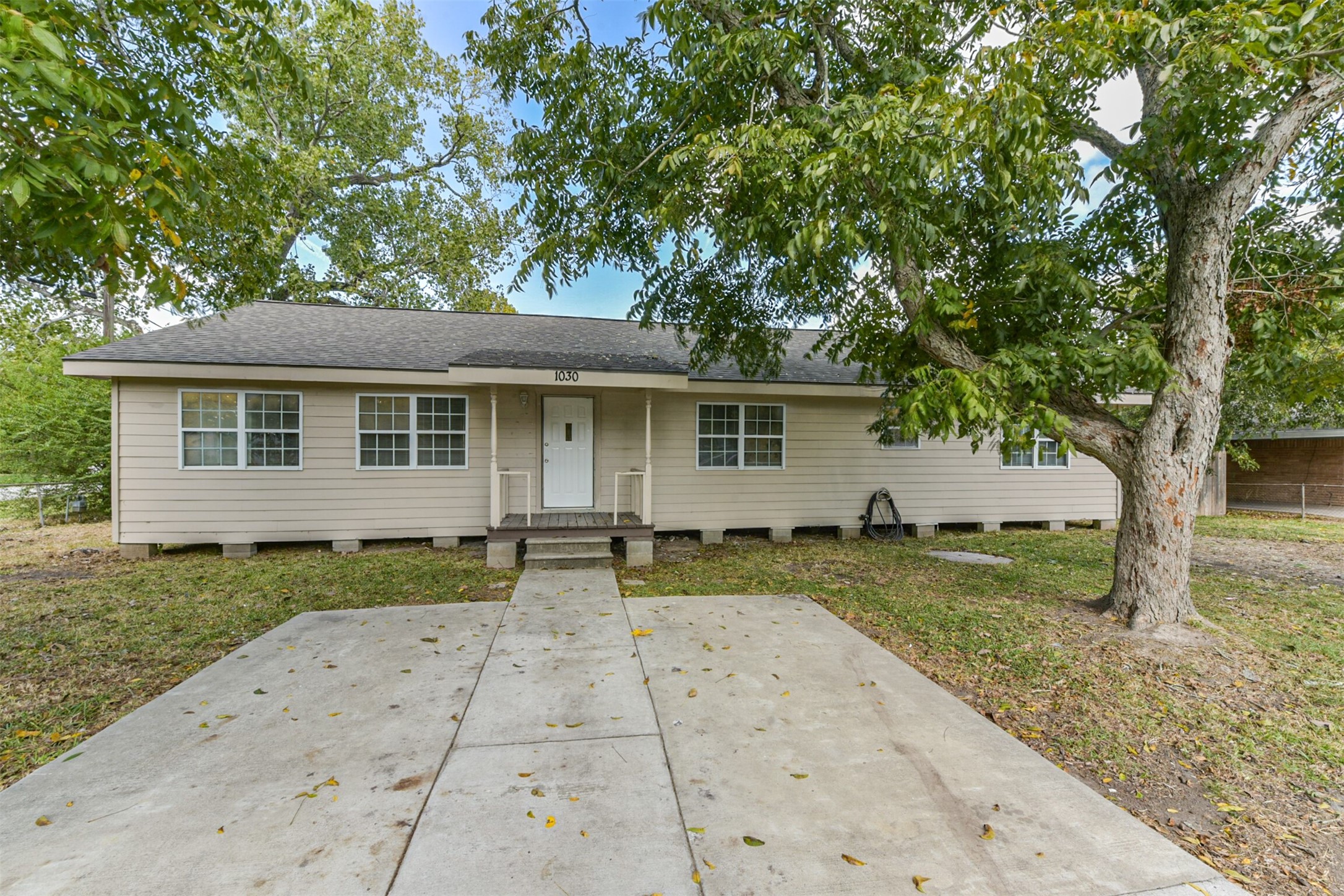1030 Perkins Drive Bacliff, TX 77518 - Photo 1 of 30 front view of a house with a yard
