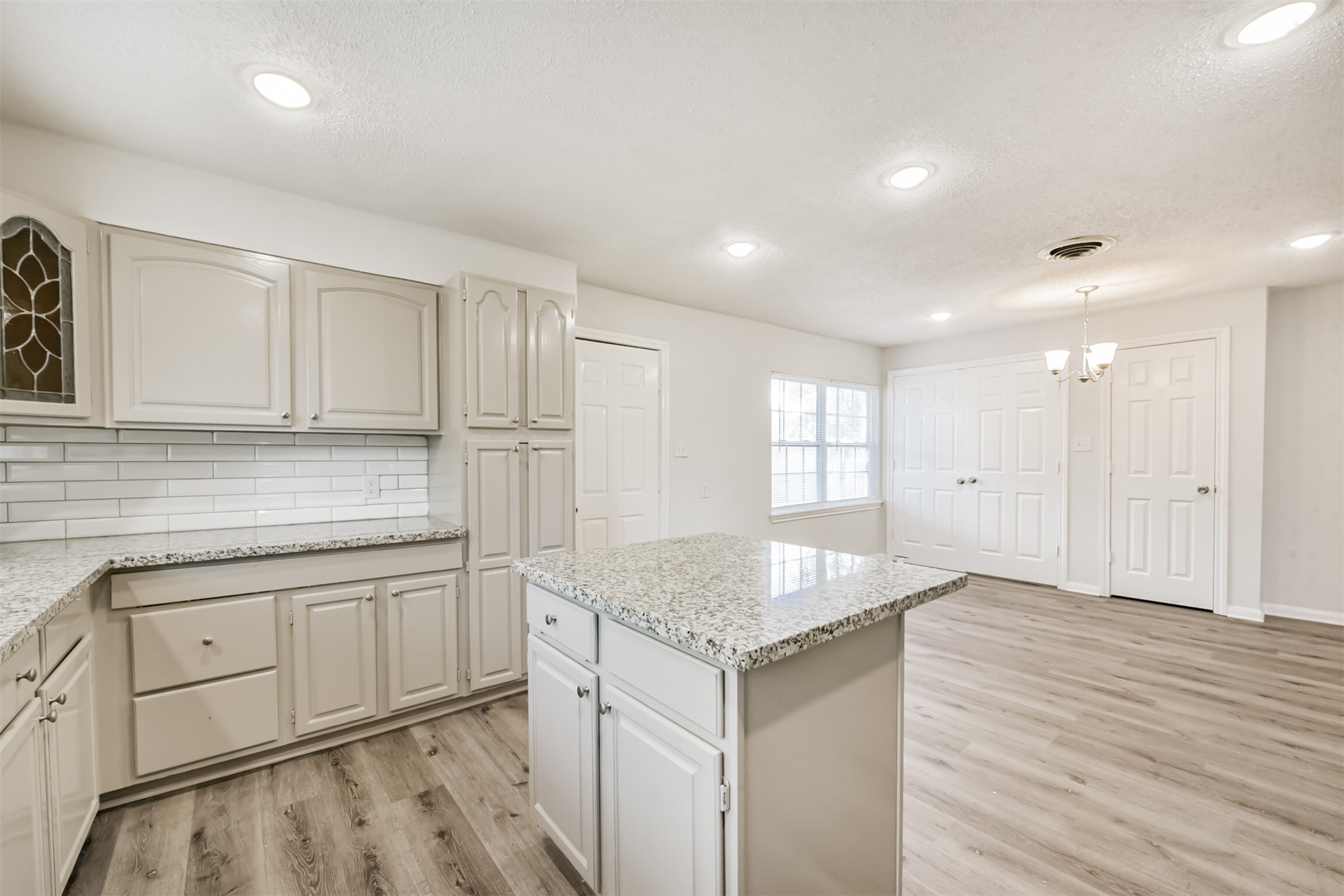 1030 Perkins Drive Bacliff, TX 77518 - Photo 12 of 30 a kitchen with sink cabinets and wooden floor
