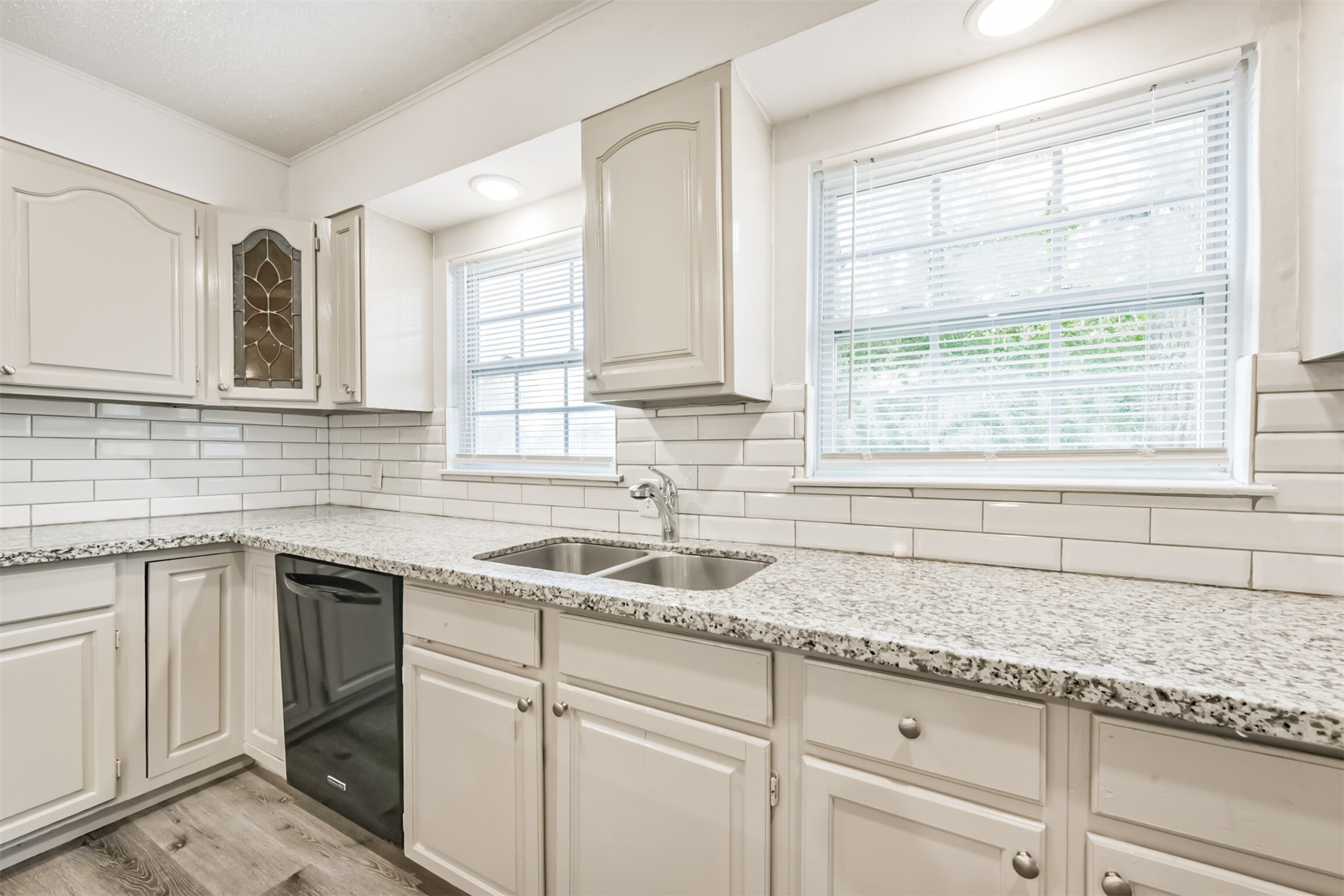 1030 Perkins Drive Bacliff, TX 77518 - Photo 13 of 30 a kitchen with granite countertop a sink cabinets and window