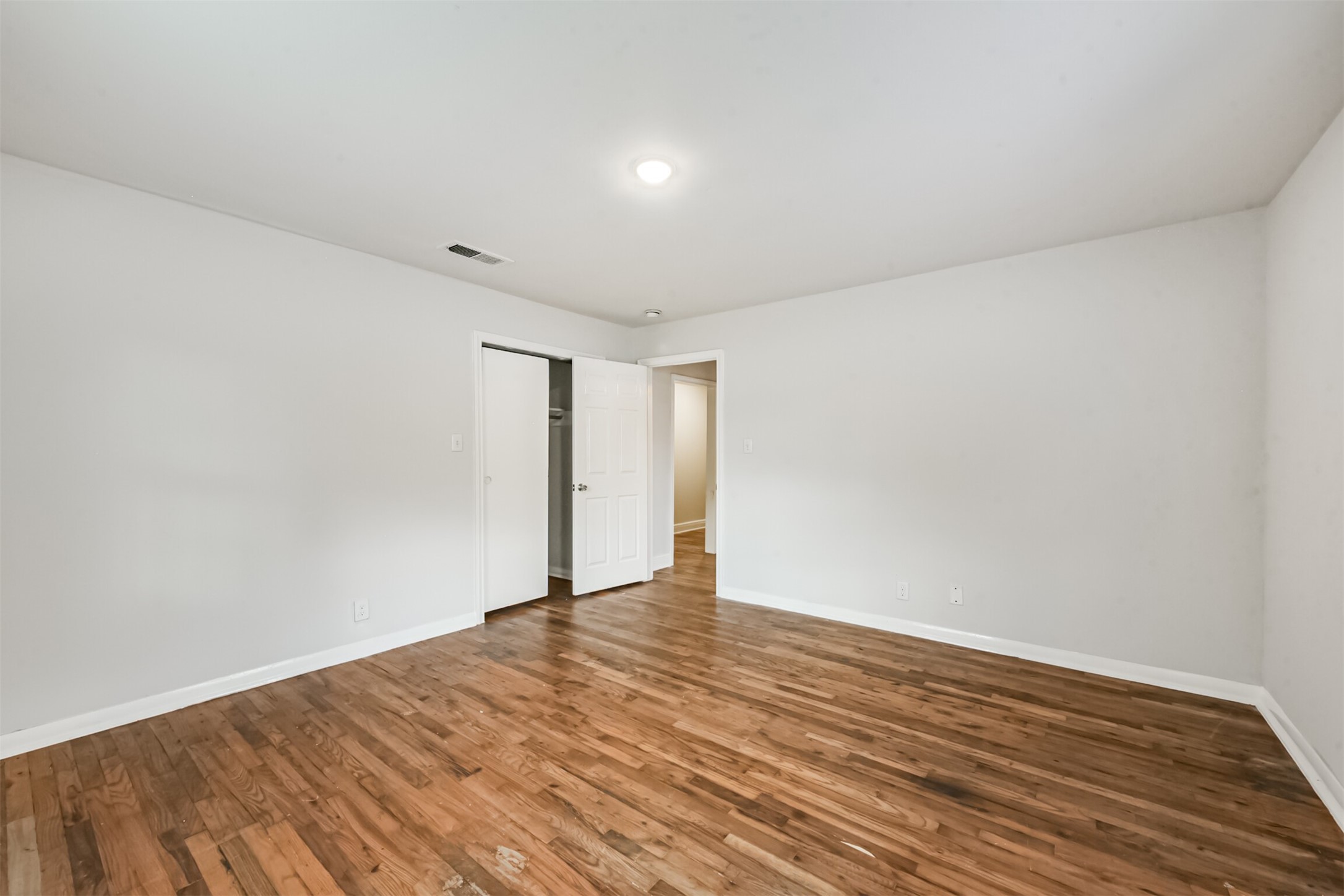 1030 Perkins Drive Bacliff, TX 77518 - Photo 25 of 30 a view of an empty room with wooden floor