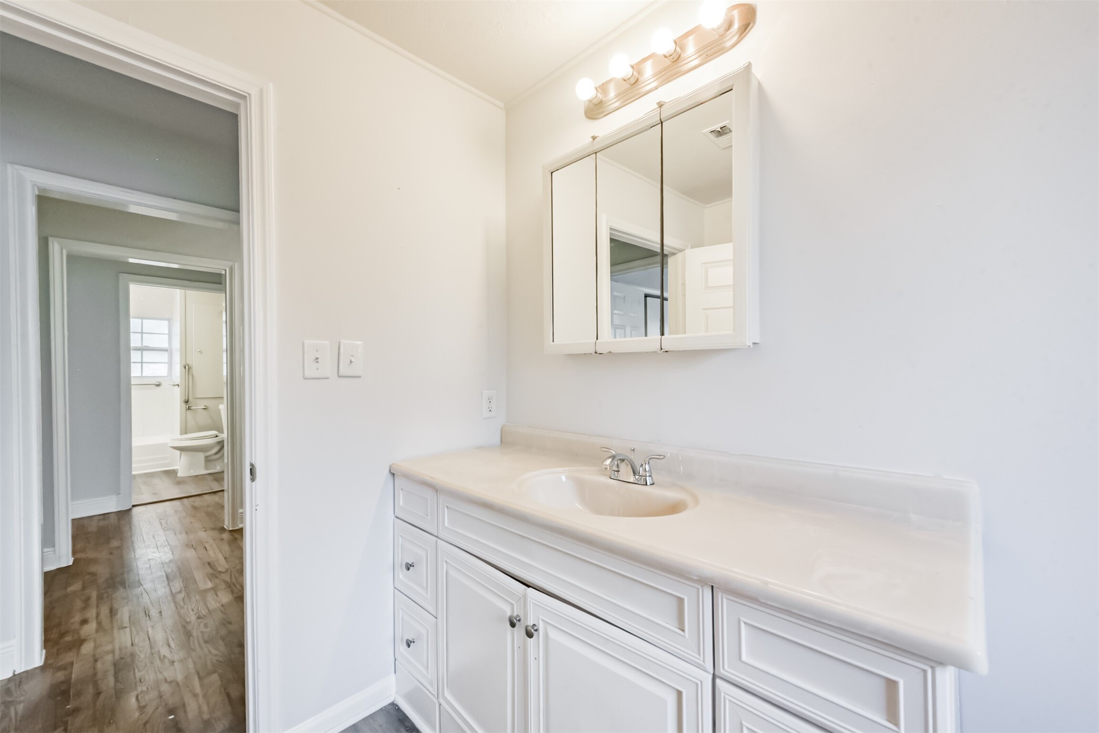 1030 Perkins Drive Bacliff, TX 77518 - Photo 30 of 30 a bathroom with a sink and a mirror