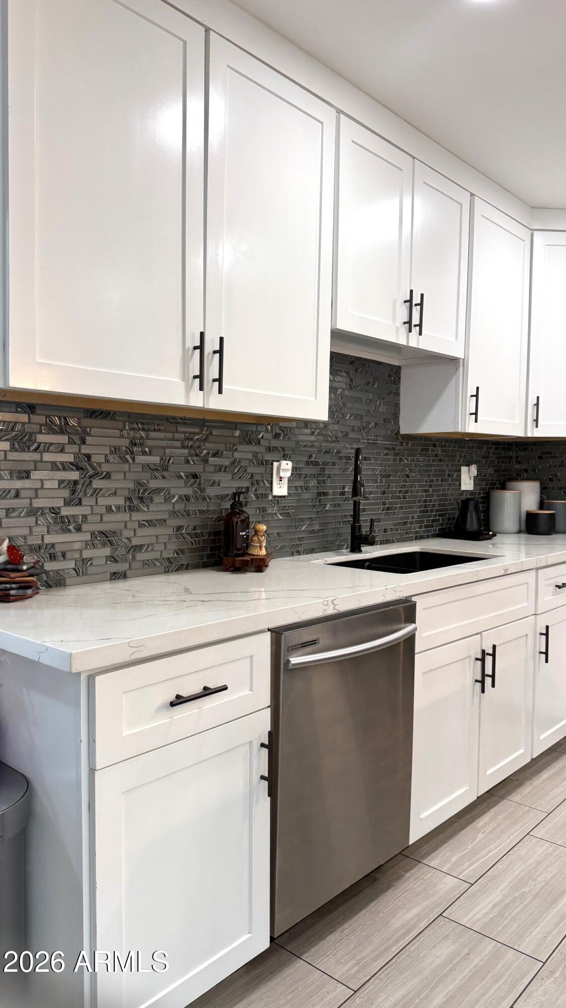 1109 West Indian School Road Phoenix, AZ 85013 - Photo 11 of 38 a kitchen with stainless steel appliances granite countertop a sink and a stove