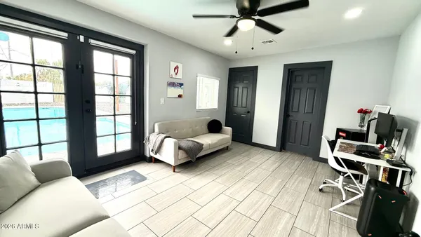 a bedroom with furniture and a window