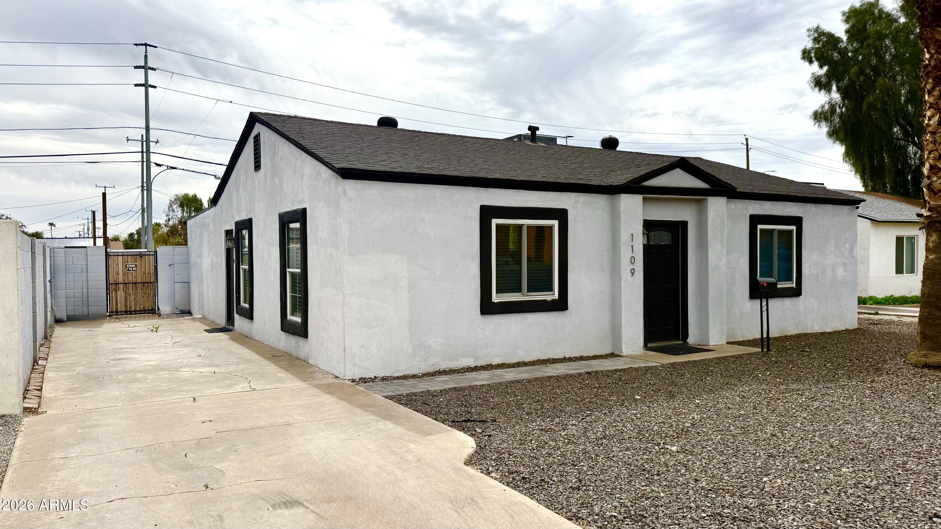 1109 West Indian School Road Phoenix, AZ 85013 - Photo 3 of 38 a view of a house with a backyard