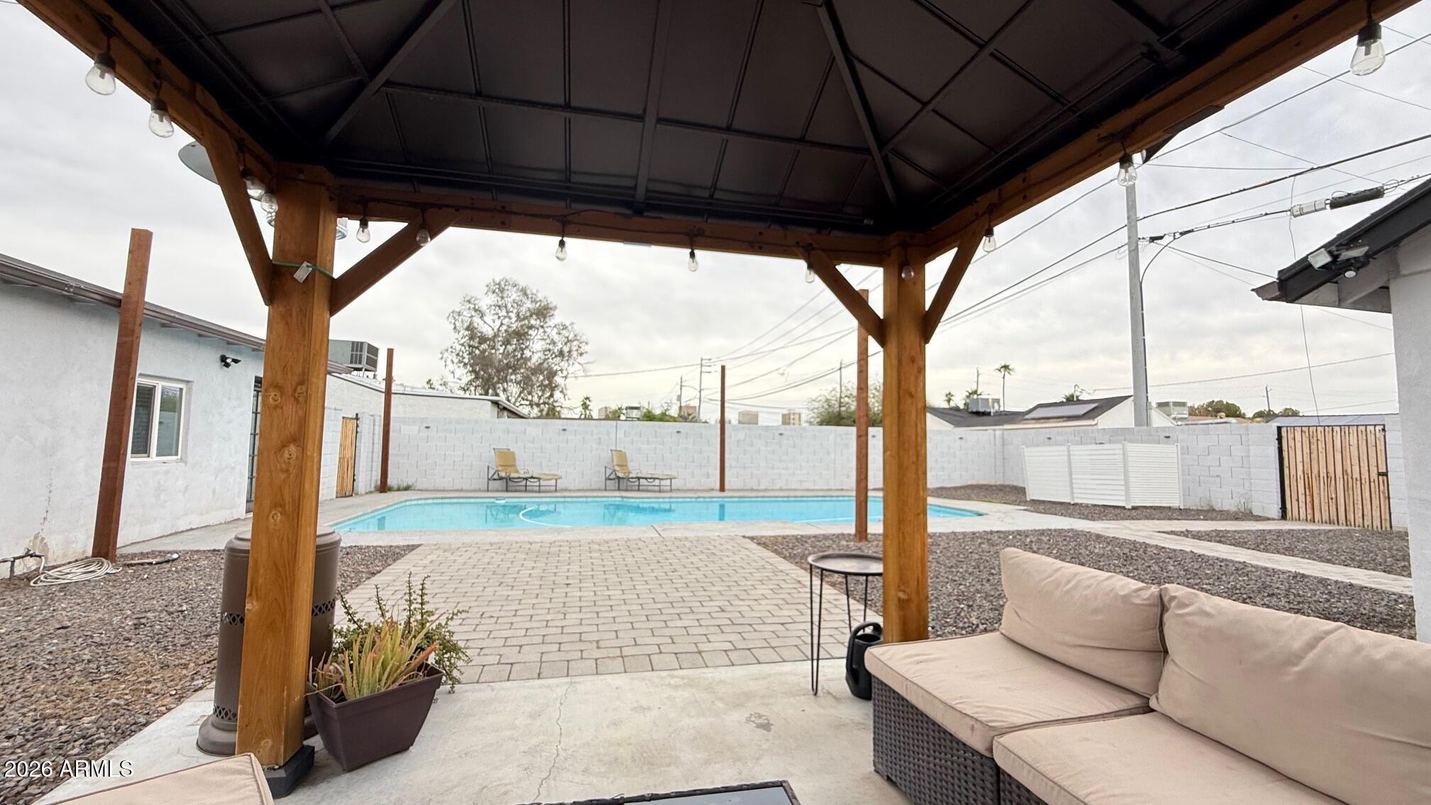 1109 West Indian School Road Phoenix, AZ 85013 - Photo 32 of 38 a view of a porch with furniture and a yard