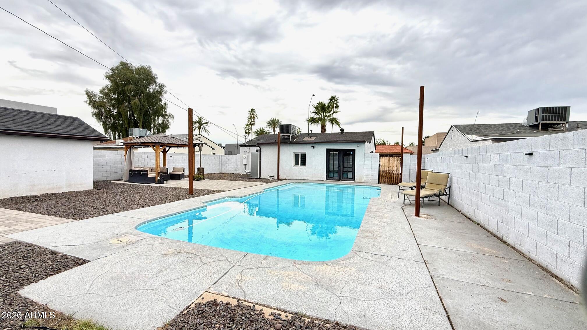1109 West Indian School Road Phoenix, AZ 85013 - Photo 38 of 38 a front view of a house with a yard