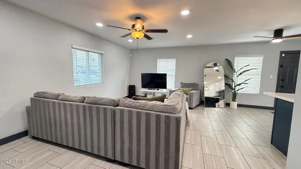 a living room with furniture and a flat screen tv