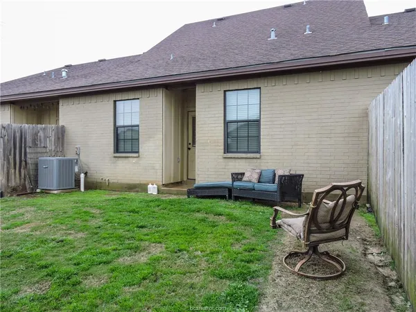 a backyard of a house with seating space