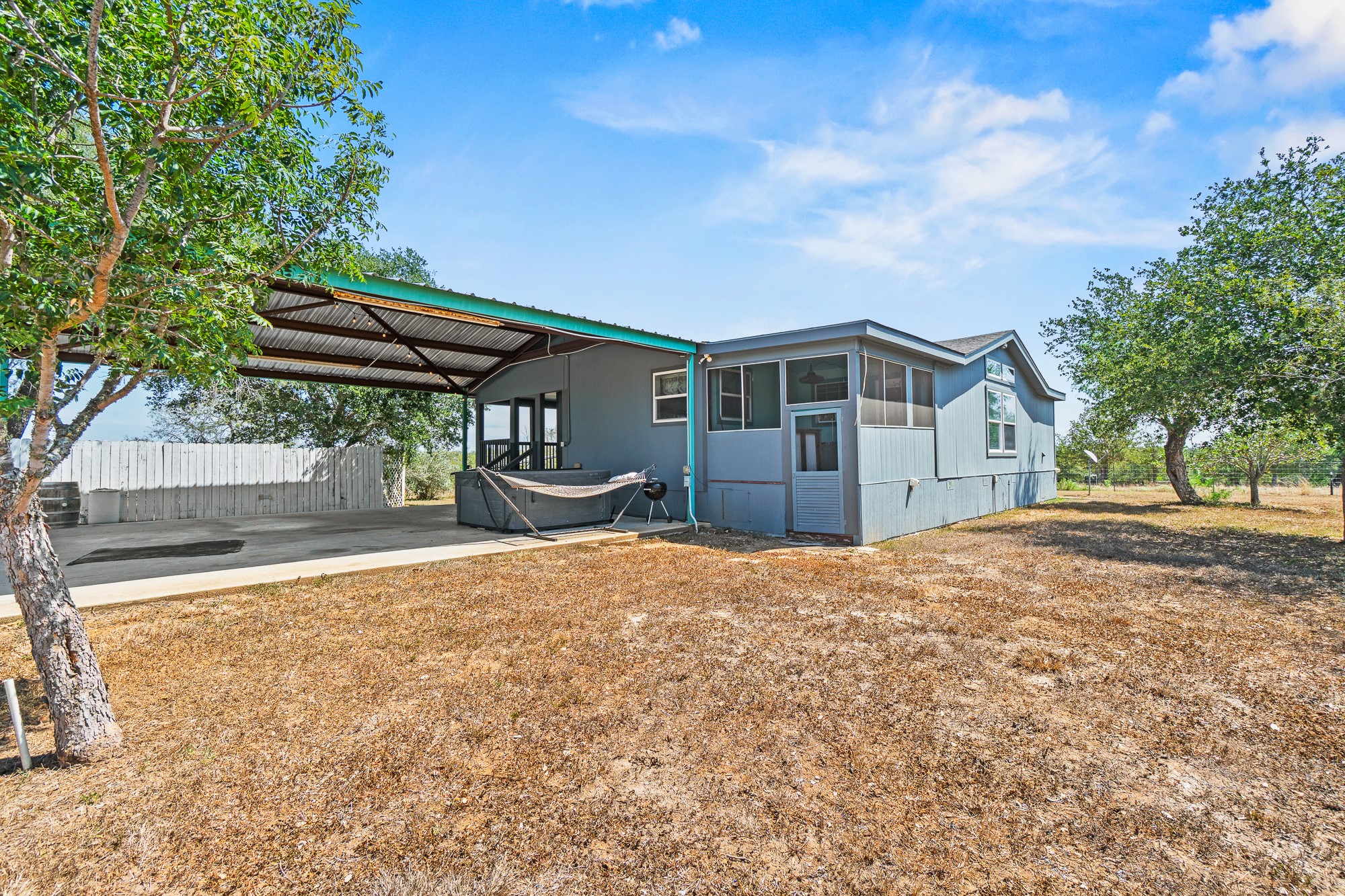 1951 Dowdy Road Seguin, TX 78155 - Photo 27 of 40 A spacious covered carport and detached storage options enhance this rural country property.