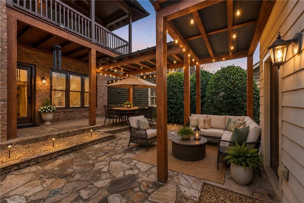 6645 Will Allen Road Cumming, GA 30040 - Photo 41 of 62 a view of a patio with couches and potted plants