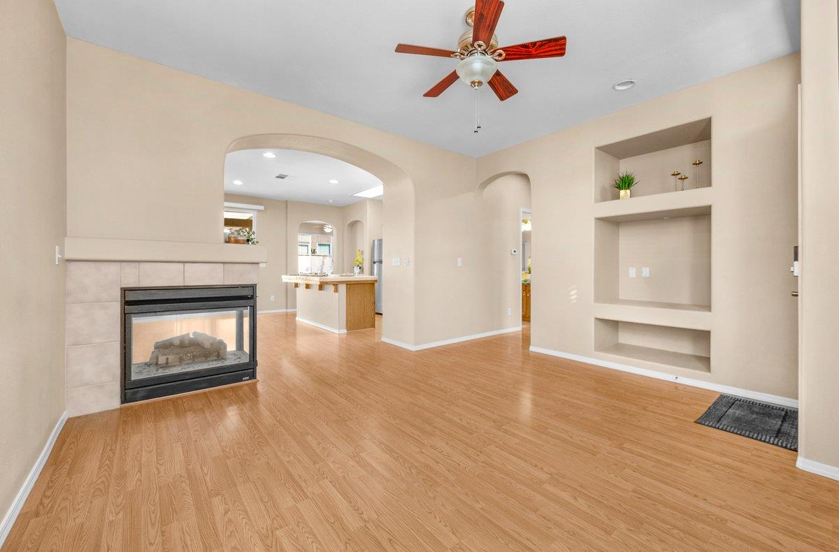 785 West Riviera Lane Clovis, CA 93619 - Photo 8 of 35 a view of an empty room and window with wooden floor