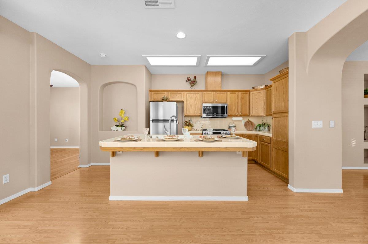 785 West Riviera Lane Clovis, CA 93619 - Photo 9 of 35 a large kitchen with a sink and cabinets
