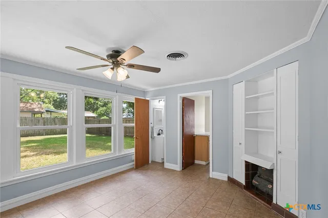 a view of an empty room with a window