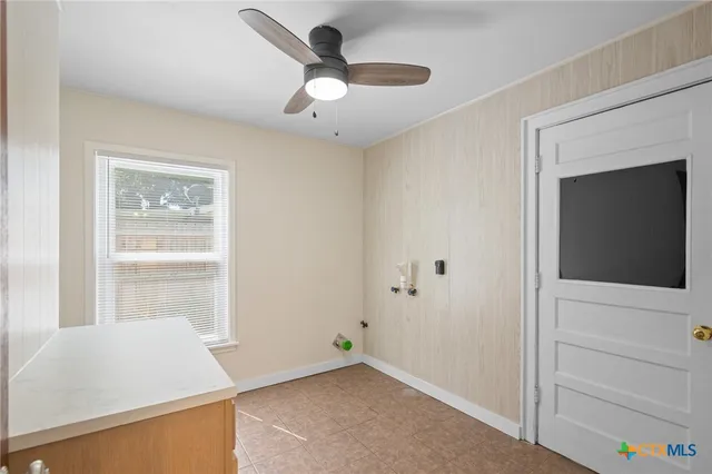 a bathroom with a granite countertop sink a toilet a mirror and shower