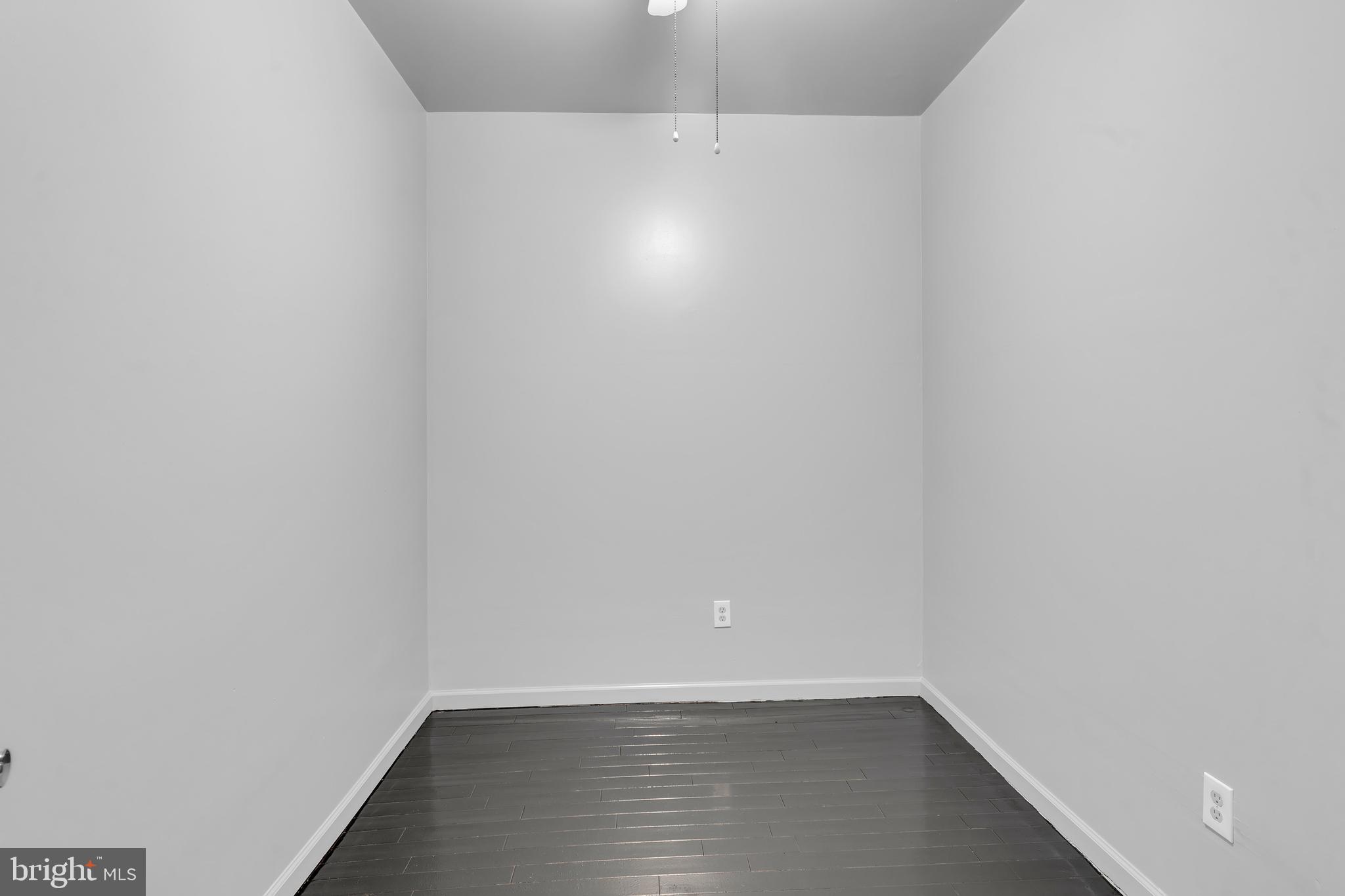 434 South 56th Street, Unit A Philadelphia, PA 19143 - Photo 17 of 19 a view of an empty room with wooden floor