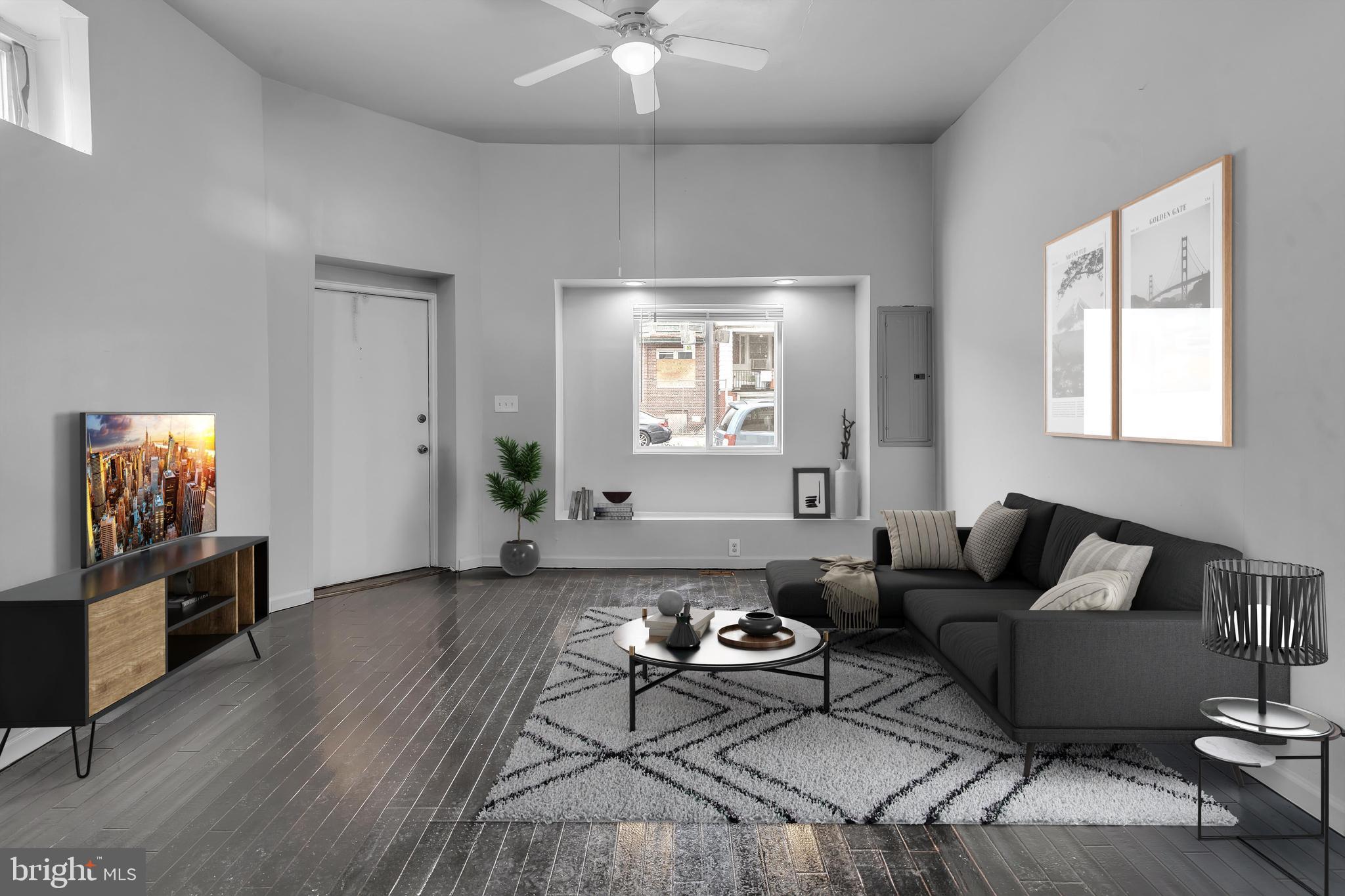 434 South 56th Street, Unit A Philadelphia, PA 19143 - Photo 2 of 19 a living room with furniture and wooden floor